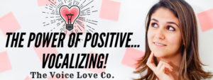 A girl looks at a lightbulb thoughtfully contemplating The Power of Positive Vocalizing. Think your way to a better voice. 3 ways how HERE at The Voice Love Co.