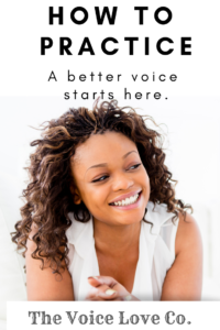 A beautiful African American young lady flashes a smile. Learn how to practice voice. A Better Voice Starts Here. At The Voice Love Co.