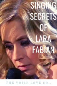 Lara Fabian sings into a mic. Singing Secrets of Lara Fabian HERE at The Voice Love Co. voicelove.co