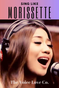 Morissette Amon sings into a microphone while wearing headphones. Sing Like Morissette via The Voice Love Co. HERE.