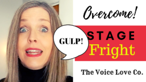 Voice Coach Christi Bovee looks frightened and GULPS! loudly. Overcome stage fright HERE at The Voice Love Co.